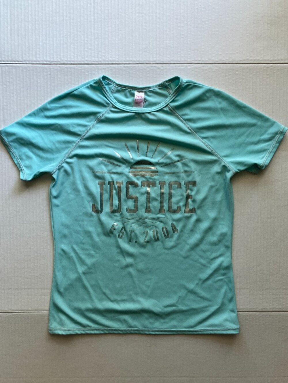 Vintage Justice Light Blue Short-Sleeve Rashguard with Silver Writing
